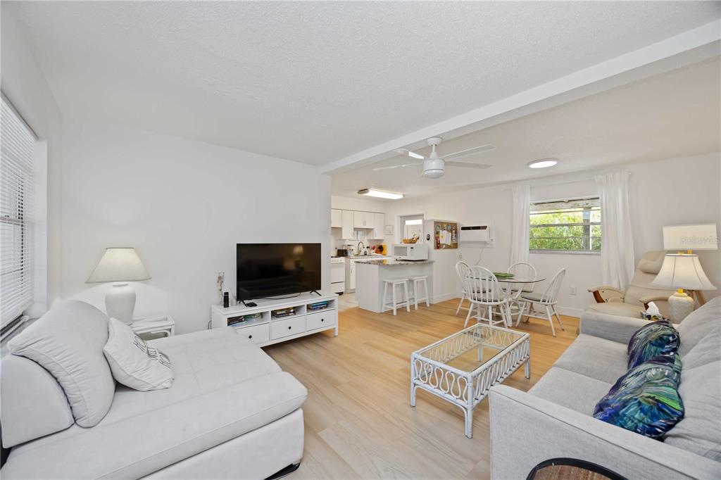 5075 North Beach Road, Unit B4 Englewood, FL 34223 - Photo 35 of 79 a living room with furniture and a flat screen tv