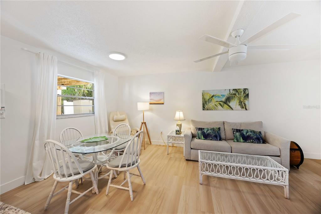 5075 North Beach Road, Unit B4 Englewood, FL 34223 - Photo 37 of 79 a living room with furniture and a wooden floor