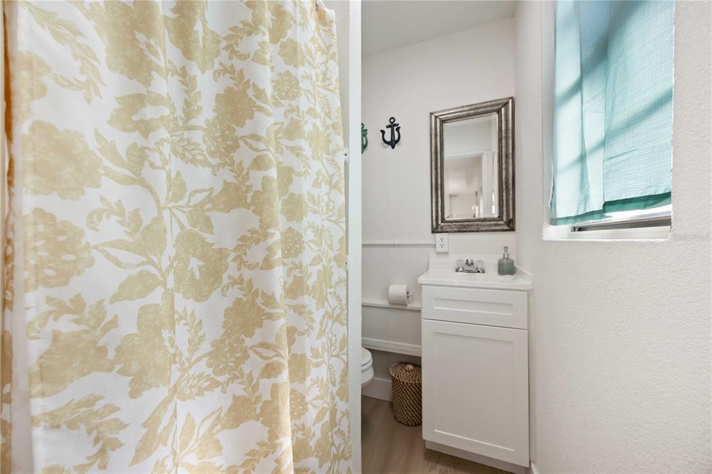 5075 North Beach Road, Unit B4 Englewood, FL 34223 - Photo 46 of 79 a bathroom with a sink toilet and shower