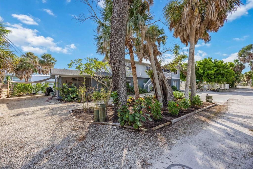 5075 North Beach Road, Unit B4 Englewood, FL 34223 - Photo 5 of 79 a front view of a house with garden