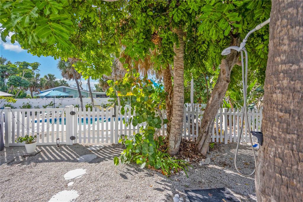5075 North Beach Road, Unit B4 Englewood, FL 34223 - Photo 51 of 79 a view of a bench in a backyard