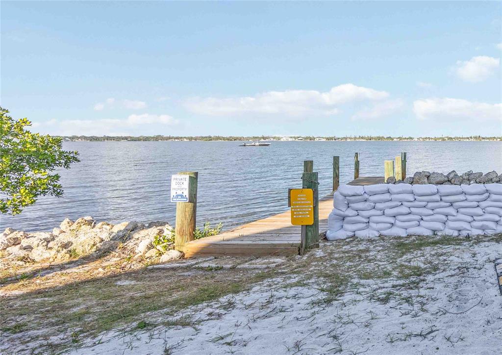 5075 North Beach Road, Unit B4 Englewood, FL 34223 - Photo 61 of 79 a street view of a river and mountain in the back