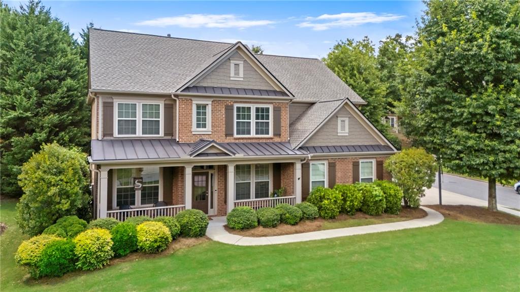 3715 Slater Street Cumming, GA 30041 - Photo 1 of 36 a front view of a house with a yard and porch