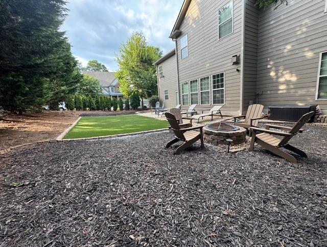 3715 Slater Street Cumming, GA 30041 - Photo 14 of 36 a view of a house with backyard and sitting area