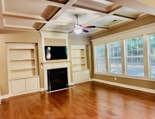 3715 Slater Street Cumming, GA 30041 - Photo 16 of 36 a view of an empty room with a fireplace and a window