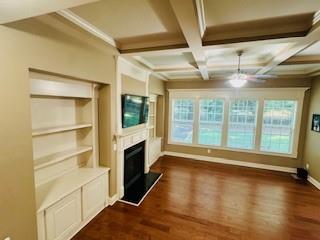3715 Slater Street Cumming, GA 30041 - Photo 17 of 36 a view of an empty room with a fireplace and a window