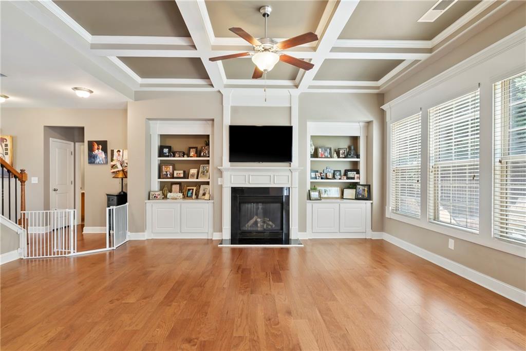 3715 Slater Street Cumming, GA 30041 - Photo 21 of 36 a view of a livingroom with a fireplace window and wooden floor