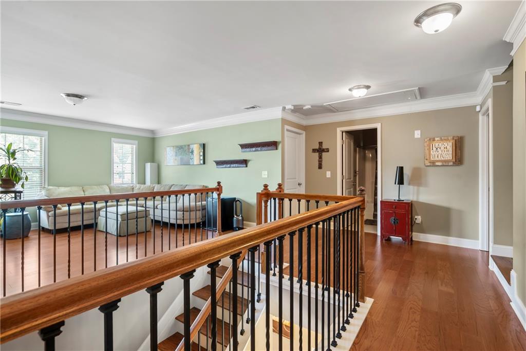 3715 Slater Street Cumming, GA 30041 - Photo 23 of 36 a view of staircase with railing and a rug