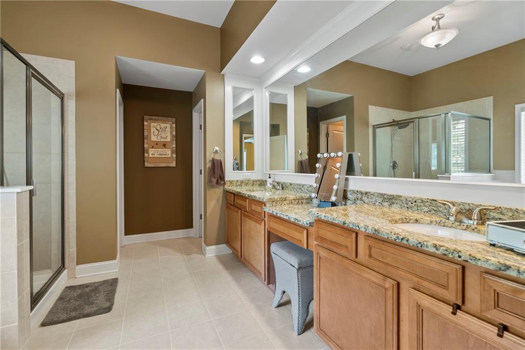 3715 Slater Street Cumming, GA 30041 - Photo 29 of 36 a bathroom with sink and mirror
