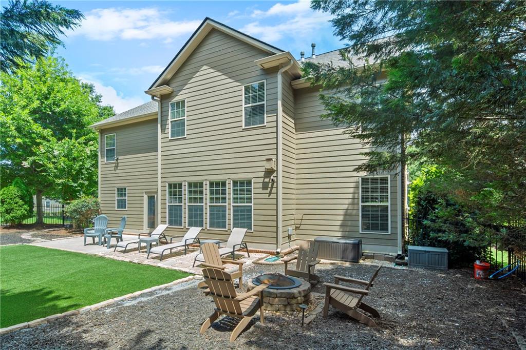 3715 Slater Street Cumming, GA 30041 - Photo 9 of 36 a backyard of a house with outdoor seating