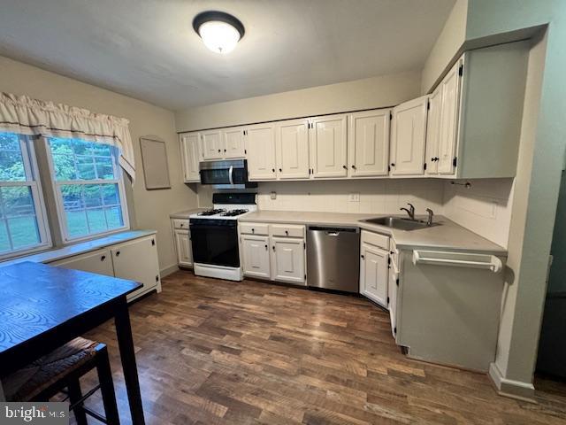 338 Ridge Road Browns Mills, NJ 08015 - Photo 15 of 38 a kitchen with a stove a sink and a refrigerator