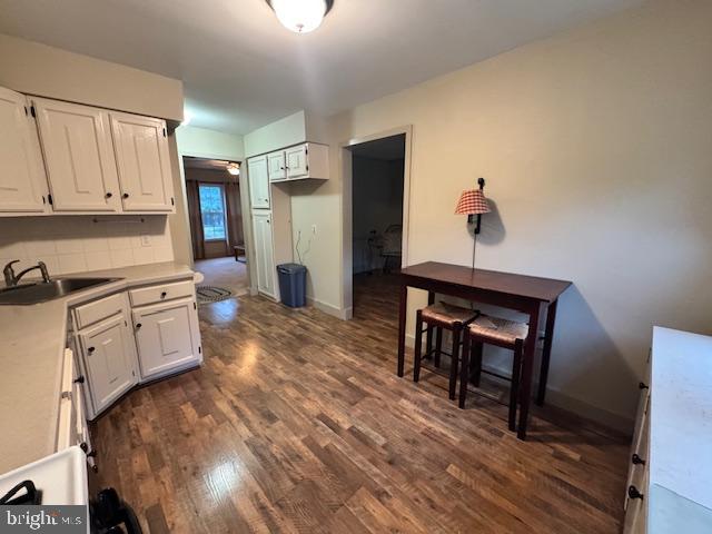 338 Ridge Road Browns Mills, NJ 08015 - Photo 16 of 38 a kitchen with stainless steel appliances granite countertop a refrigerator a stove and white cabinets with wooden floor
