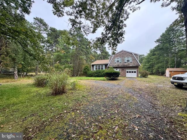 338 Ridge Road Browns Mills, NJ 08015 - Photo 2 of 38 a front view of a house with garden