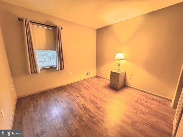 338 Ridge Road Browns Mills, NJ 08015 - Photo 23 of 38 a view of an empty room and wooden floor
