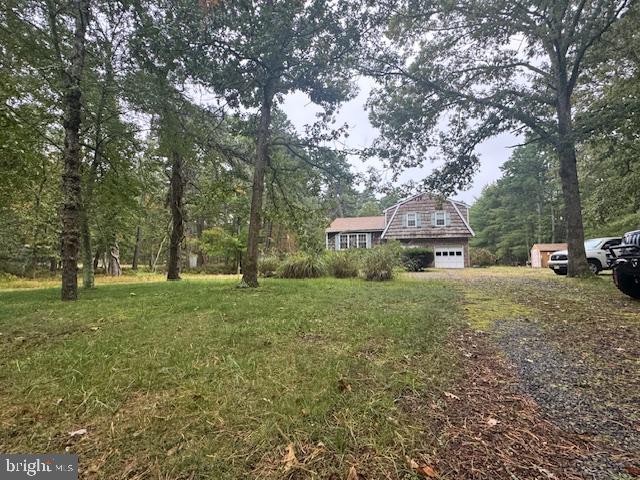 338 Ridge Road Browns Mills, NJ 08015 - Photo 4 of 38 a house view with a garden space