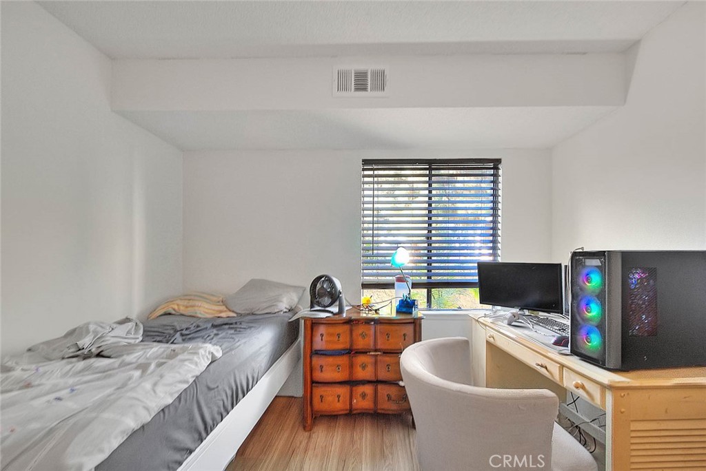 700 West 3rd Street, Unit A111 Santa Ana, CA 92701 - Photo 7 of 15 a living room with furniture and a flat screen tv