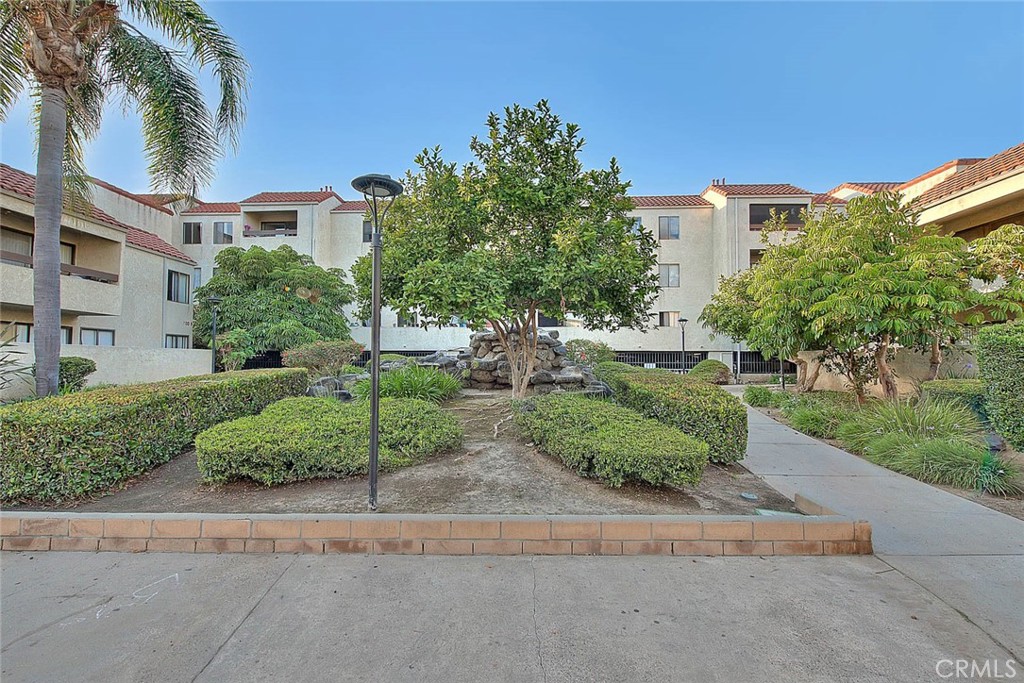 700 West 3rd Street, Unit A111 Santa Ana, CA 92701 - Photo 10 of 15 a view of a garden with a houses