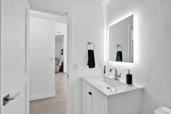 a bathroom with a sink and a mirror