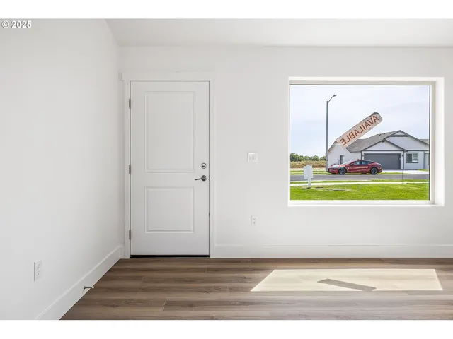 a view of a small space with wooden floor