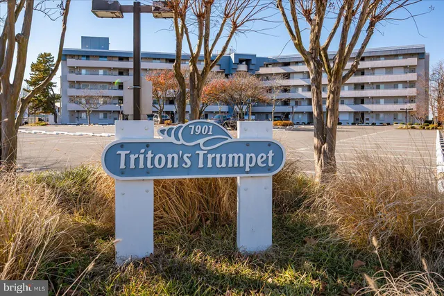 a sign board with parking space
