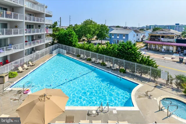 a view of swimming pool from a balcony