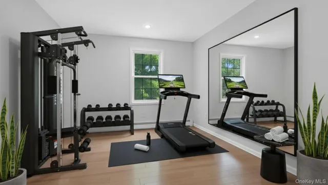 a room with gym equipment and windows