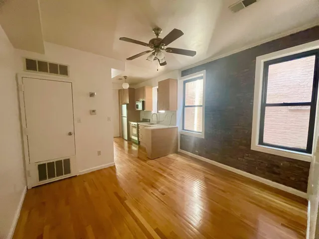 a view of a kitchen with a sink and cabinet area