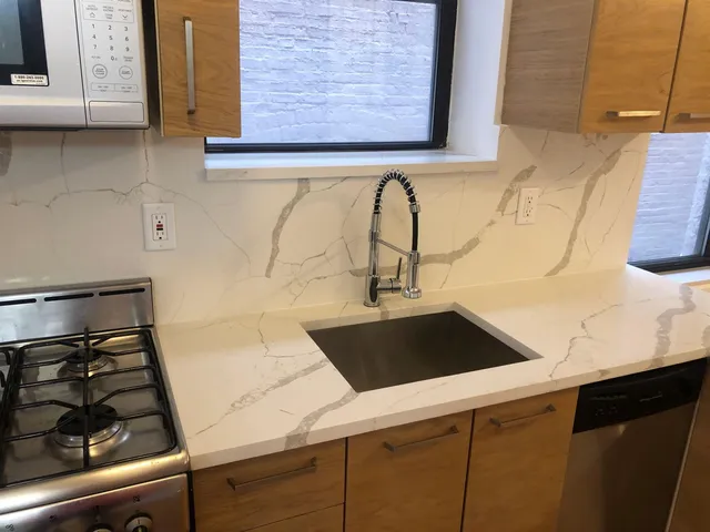 a close view of a sink and dishwasher