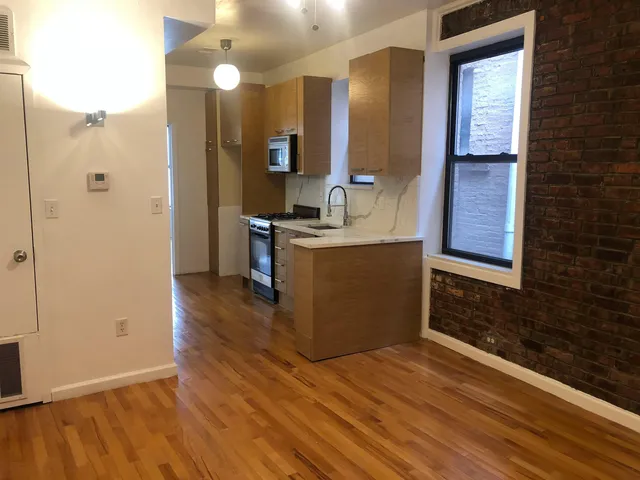 a view of a kitchen from the hallway