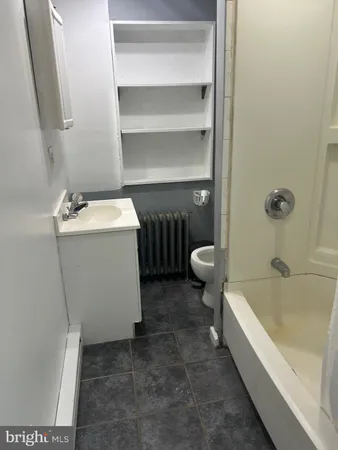 a bathroom with a sink and toilet