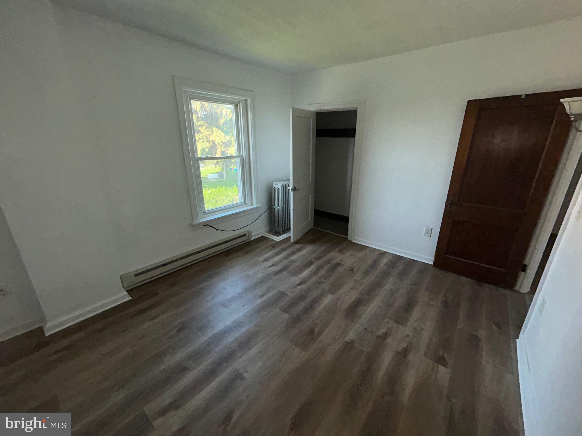 5 East Maple Street, Unit 2 Lebanon, PA 17046 - Photo 8 of 10 a view of an empty room with wooden floor and a window