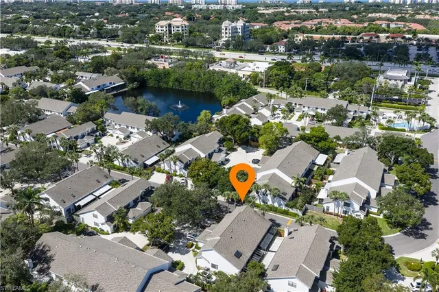 an aerial view of a house with a swimming pool yard and outdoor seating