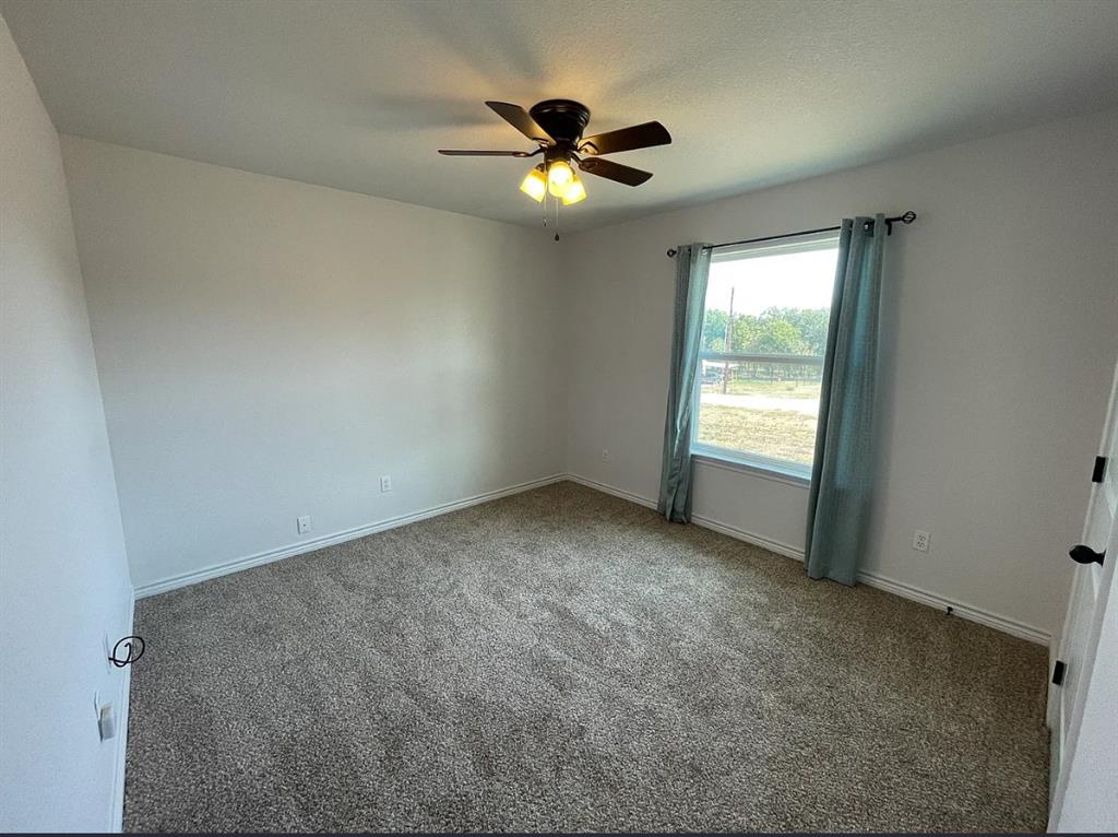 109 Spruce Tree Court Poolville, TX 76487 - Photo 17 of 21 a view of an empty room with a window