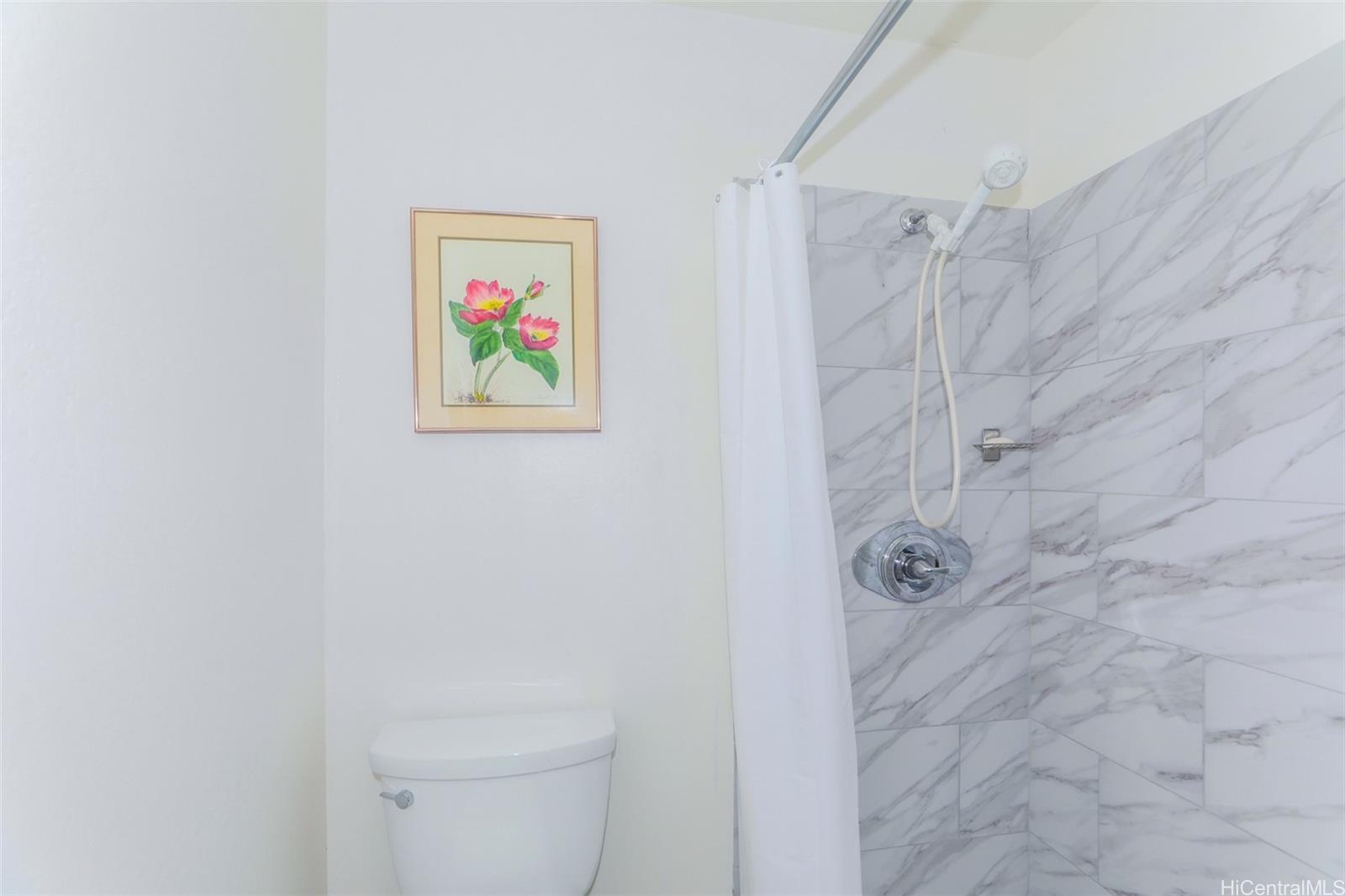 1540 Magazine Street, Unit C/3 Honolulu, HI 96822 - Photo 18 of 25 a bathroom with a painting on the wall and shower