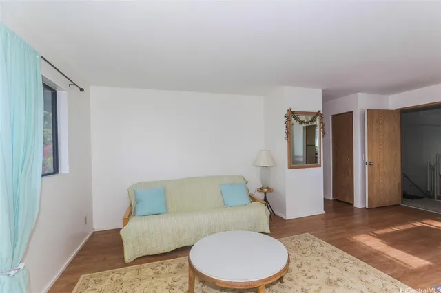 a living room with furniture and a rug