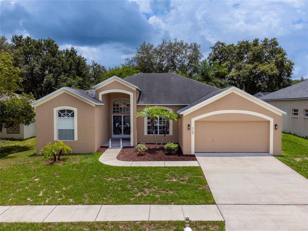 4109 Amber Ridge Lane Valrico, FL 33594 - Photo 1 of 1 a front view of a house with a yard and garage