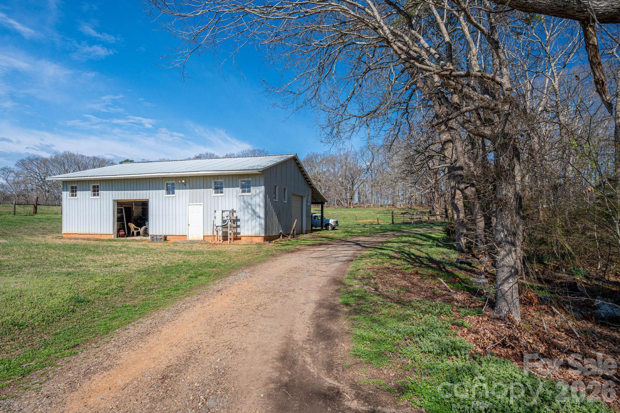 221 Lee Black Road Cherryville, NC 28021 - Photo 12 of 48 a front view of a house with a yard and a garage