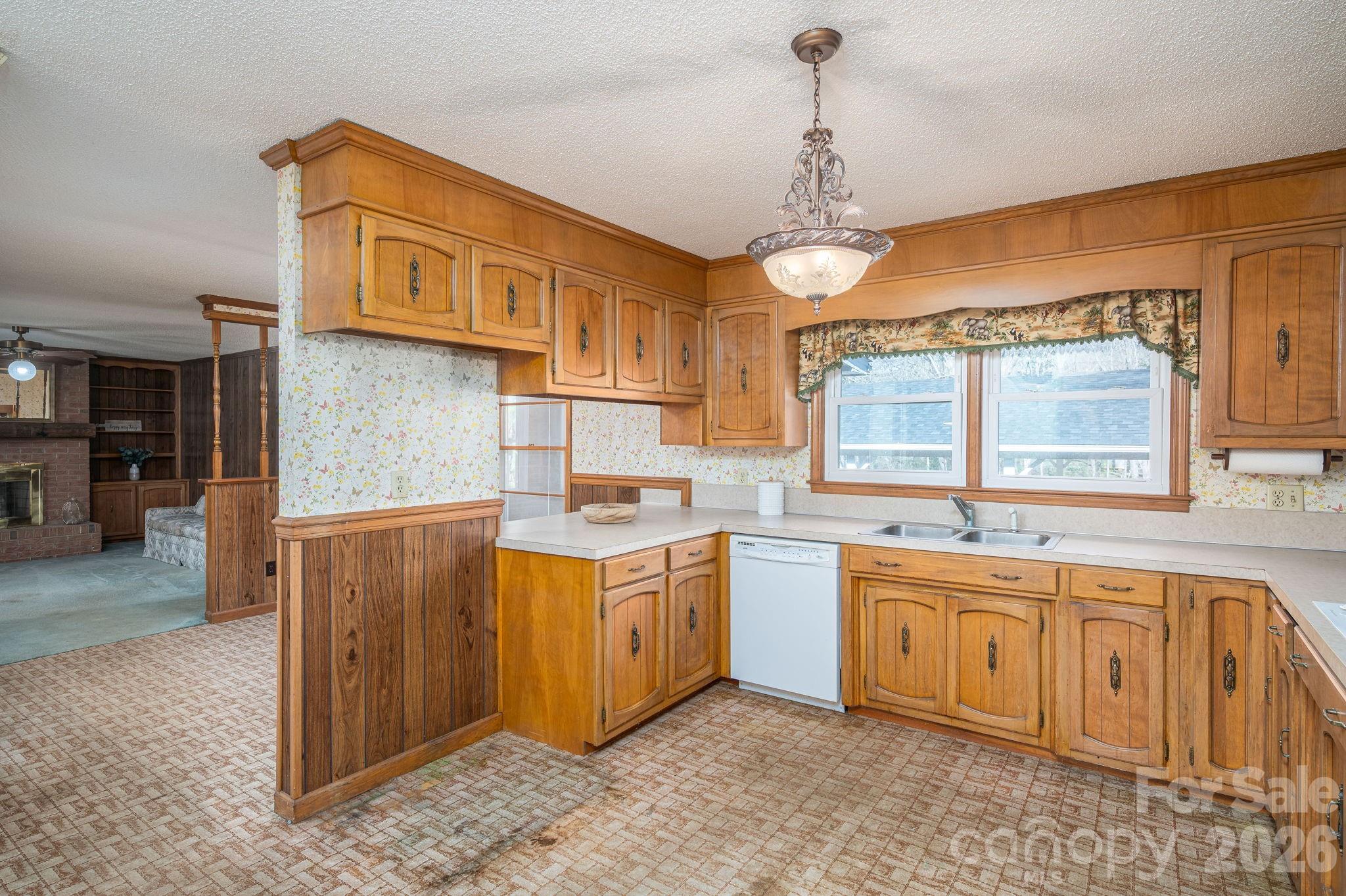 221 Lee Black Road Cherryville, NC 28021 - Photo 12 of 48 a kitchen that has a sink and a stove in it