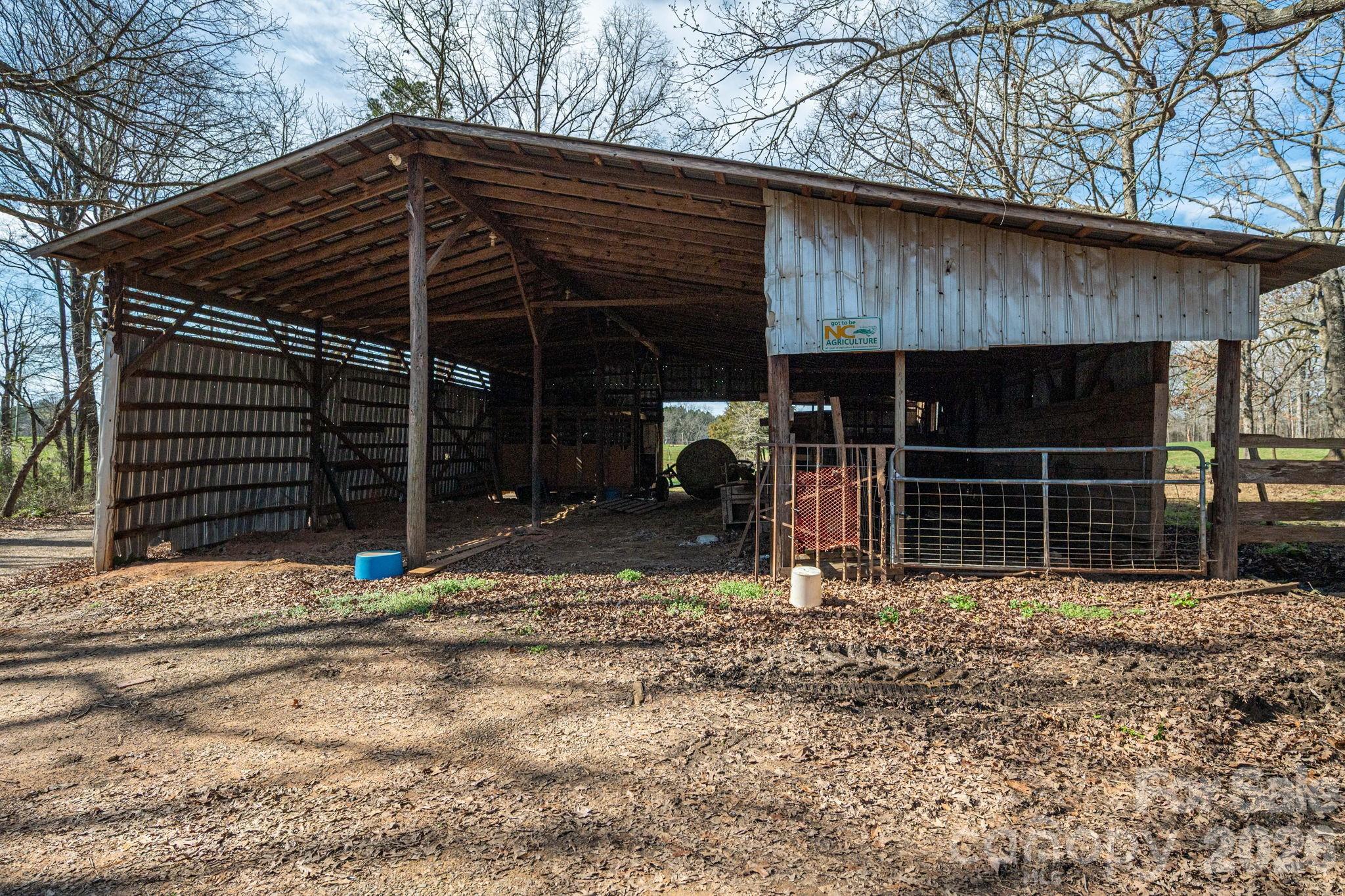 221 Lee Black Road Cherryville, NC 28021 - Photo 16 of 48 a view of house with door and wooden fence