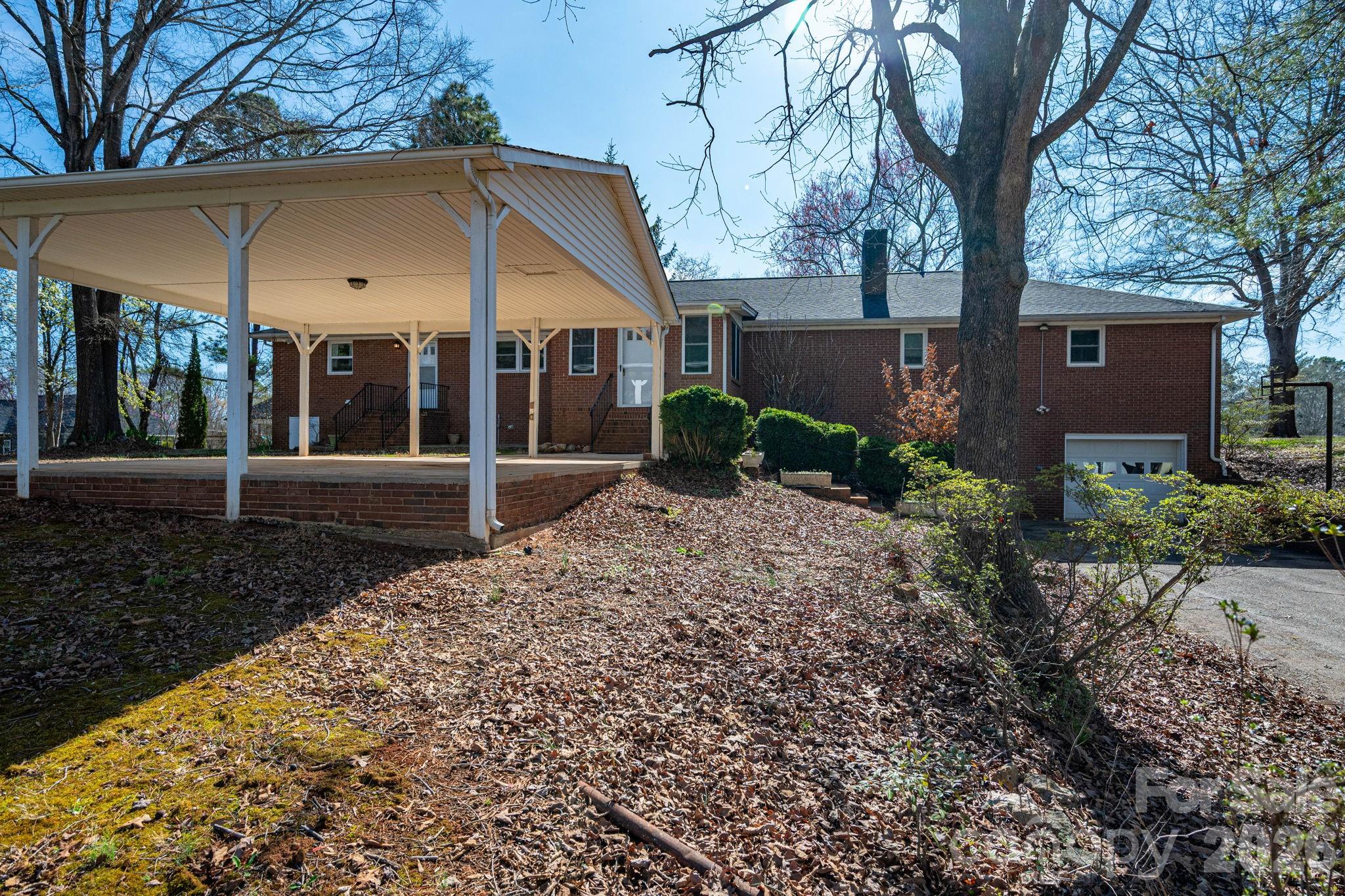 221 Lee Black Road Cherryville, NC 28021 - Photo 21 of 48 a view of a house with a yard and tree
