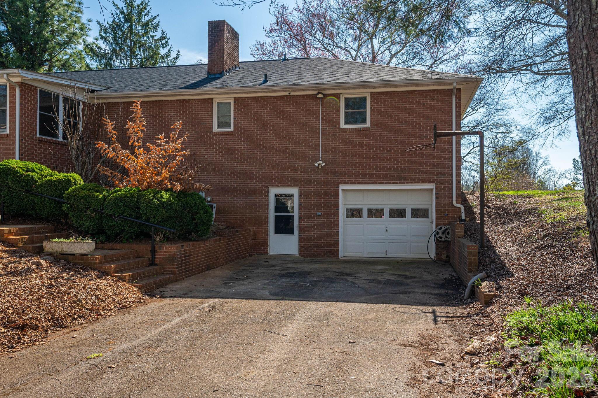 221 Lee Black Road Cherryville, NC 28021 - Photo 22 of 48 a view of a house with a yard