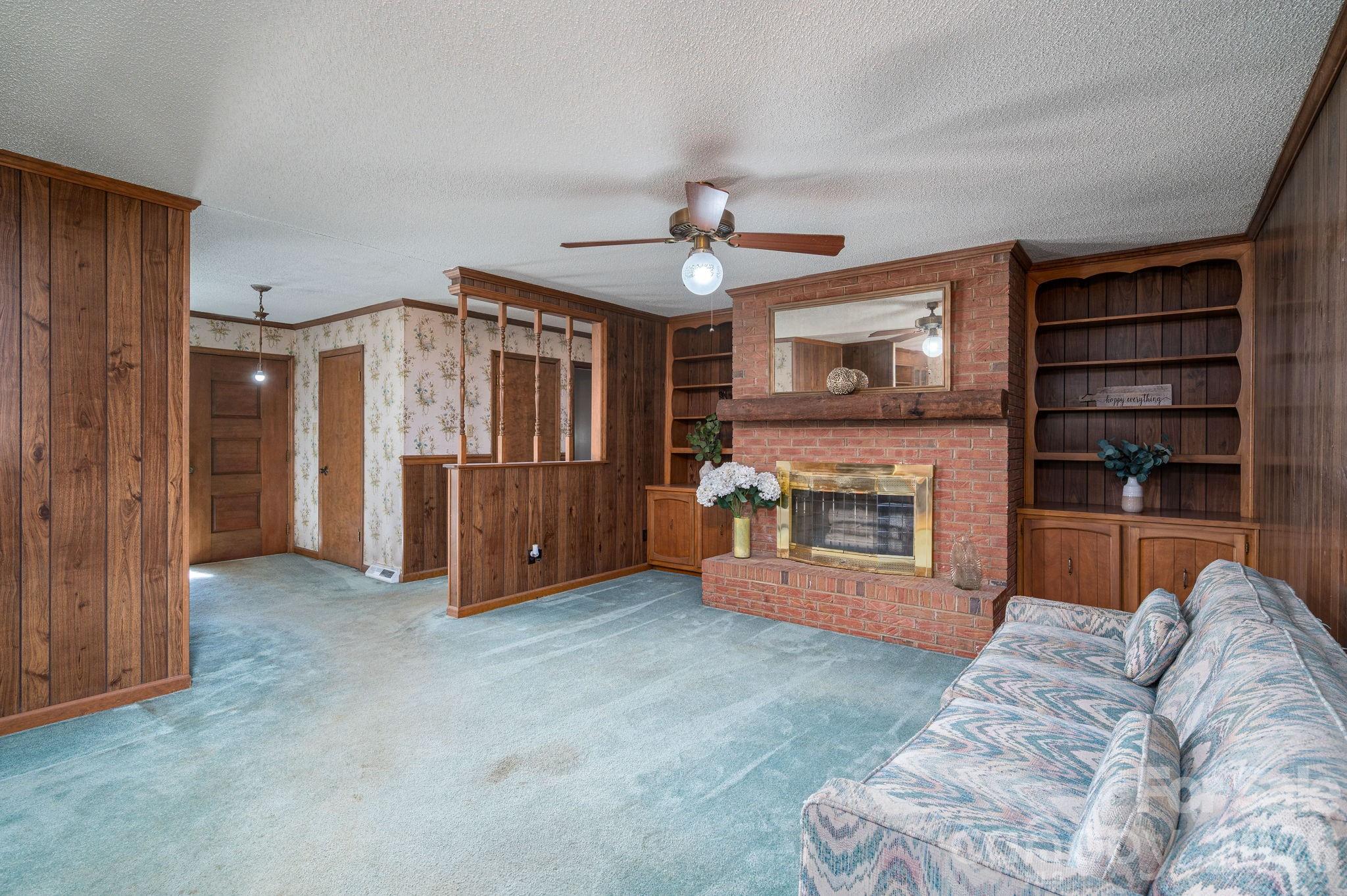 221 Lee Black Road Cherryville, NC 28021 - Photo 33 of 48 a living room with furniture and a fireplace