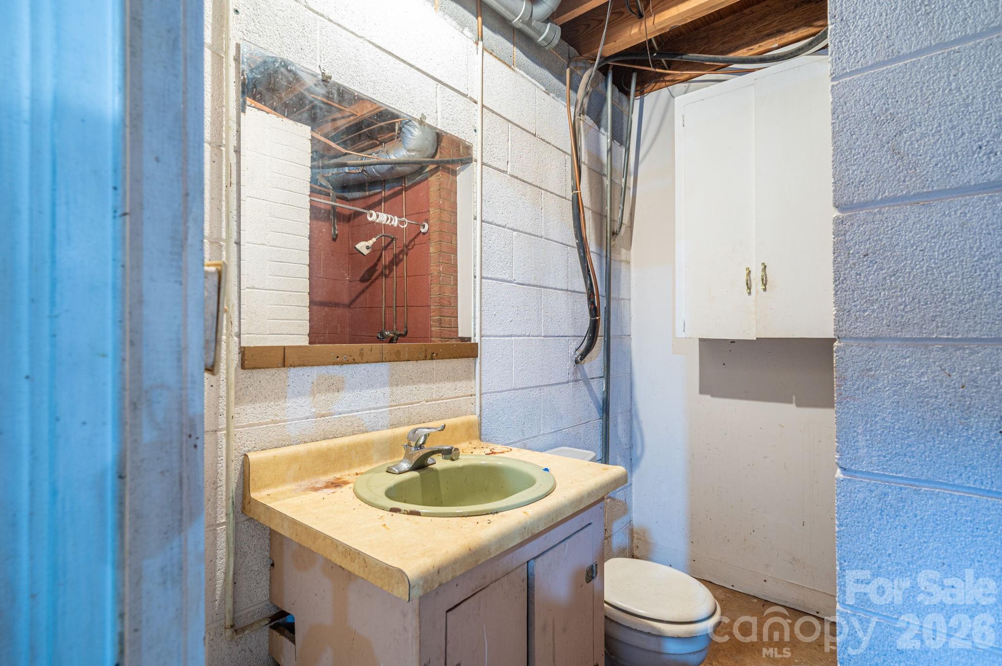 221 Lee Black Road Cherryville, NC 28021 - Photo 47 of 48 a bathroom with a sink toilet and shower
