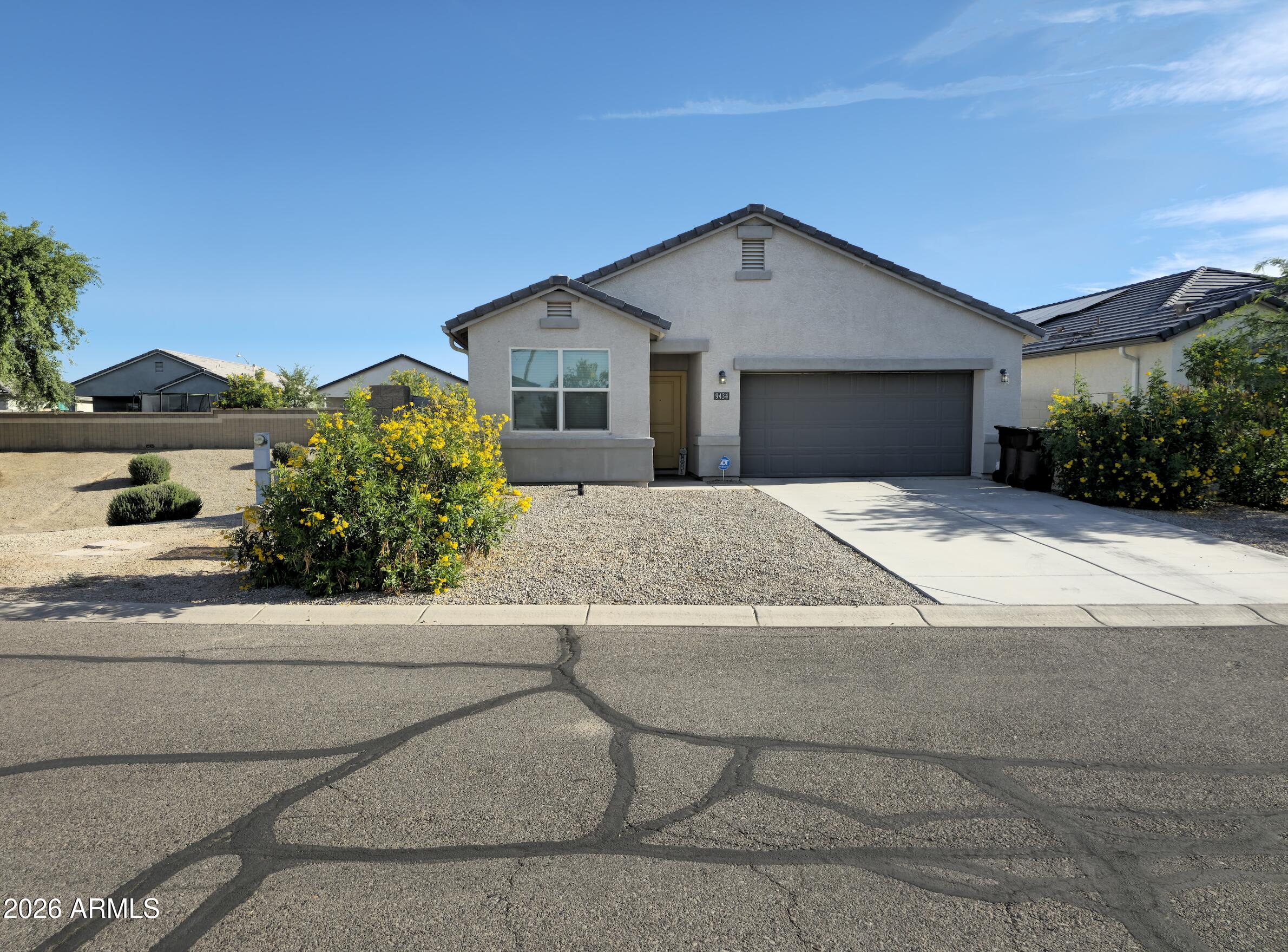 9434 Cotton Road Florence, AZ 85132 - Photo 1 of 25 a front view of a house with a yard