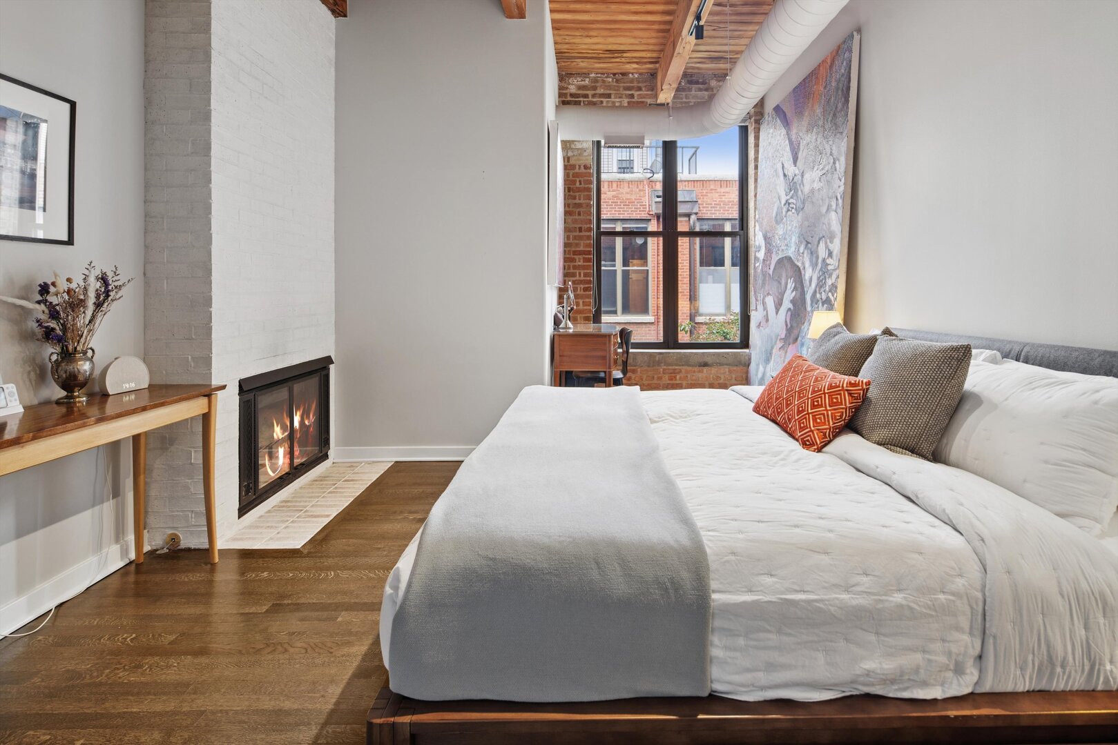 2222 North Racine Avenue, Unit 16 Chicago, IL 60614 - Photo 14 of 32 a bedroom with a bed and a fireplace