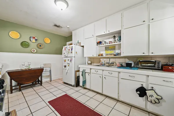 a kitchen with stainless steel appliances granite countertop a sink and a stove