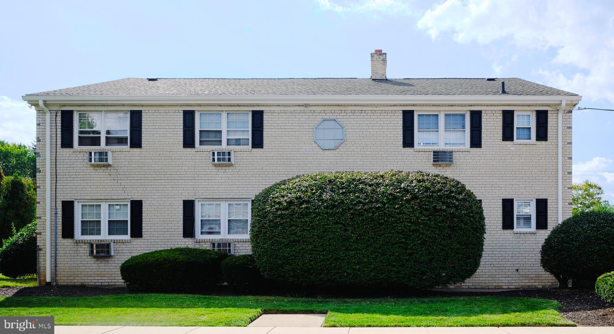 403 South Main Street, Unit S201 Doylestown, PA 18901 - Photo 11 of 13 a front view of a house with a yard