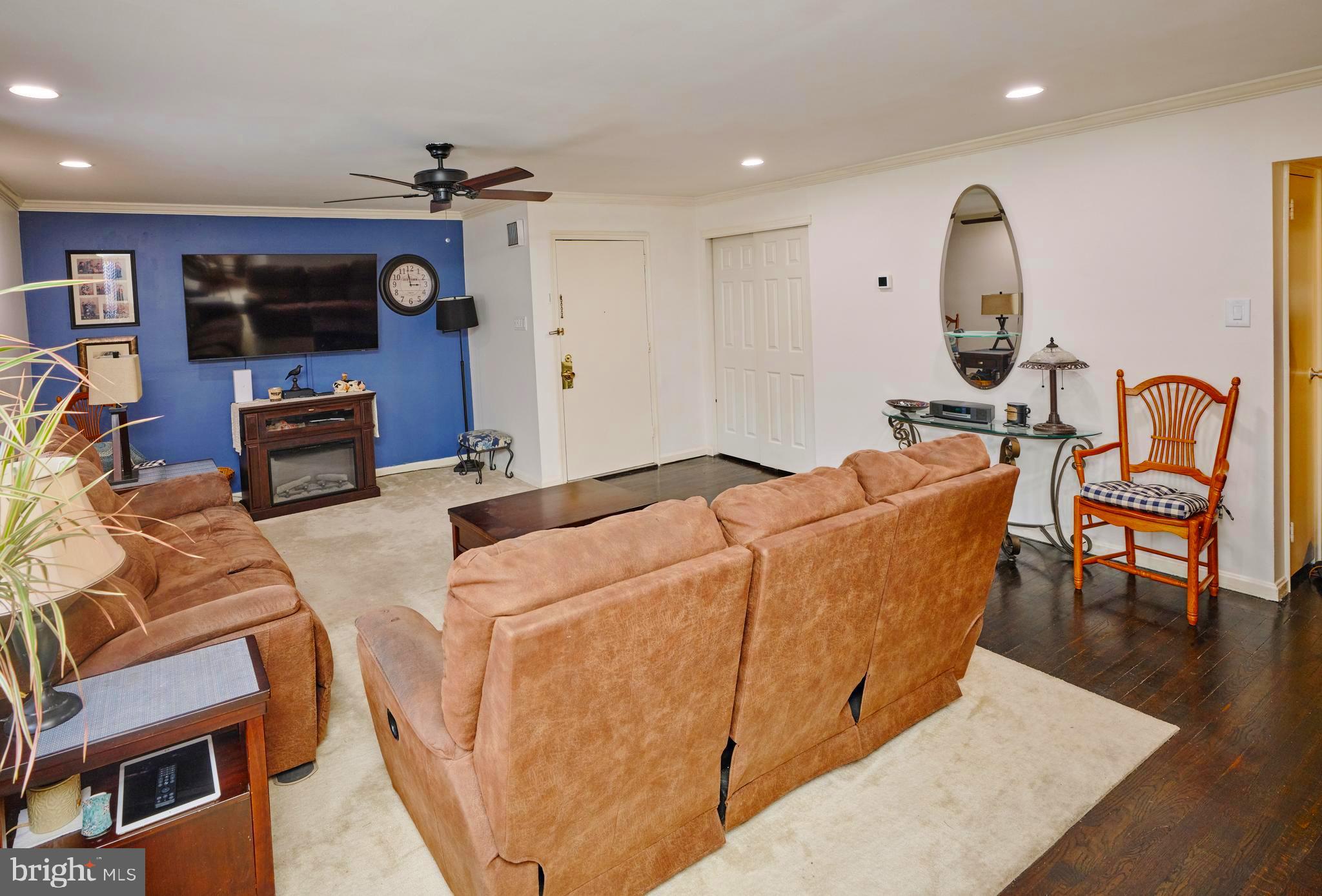 403 South Main Street, Unit S201 Doylestown, PA 18901 - Photo 2 of 13 a living room with furniture and a fireplace