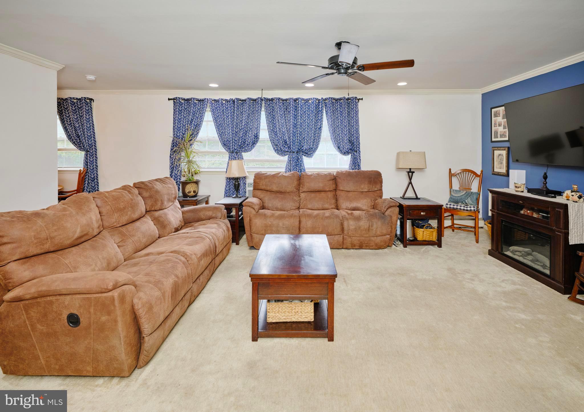 403 South Main Street, Unit S201 Doylestown, PA 18901 - Photo 3 of 13 a living room with furniture and a flat screen tv
