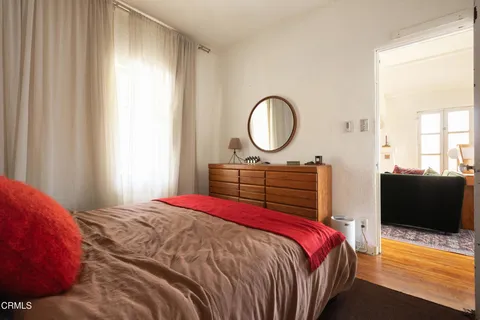 a bedroom with a large bed and a couch